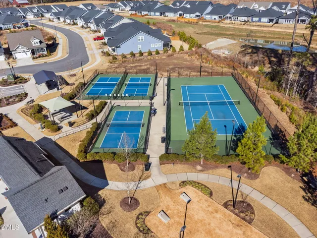 a backyard of a house with outdoor seating