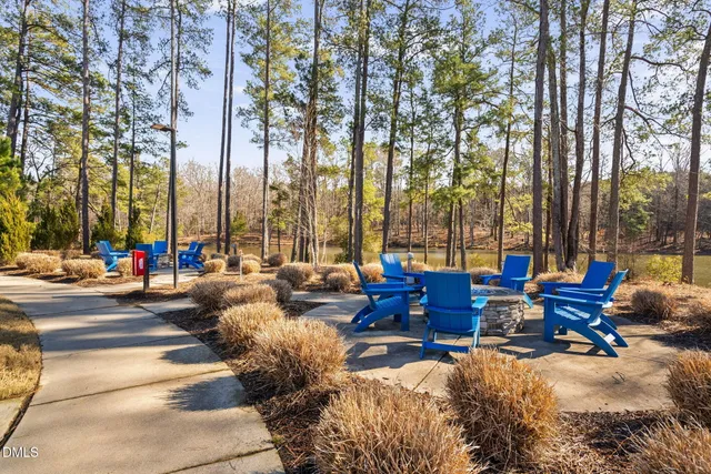 a view of balcony with wooden floor and fence