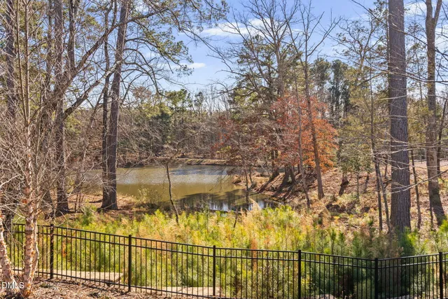a view of a chairs and table in kitchen
