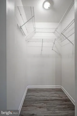 a bathroom with a granite countertop sink mirror and a toilet