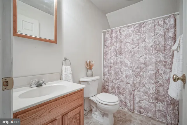 a view of room with window and cabinet