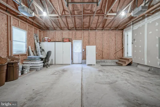 a view of a house with yard and sitting area