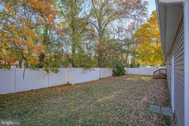 a view of swimming pool with outdoor seating and ocean view