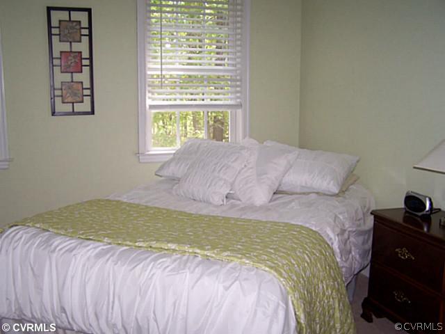 1852 Taylor Road Crozier, VA 23039 - Photo 9 of 12 a bedroom with a bed and a window