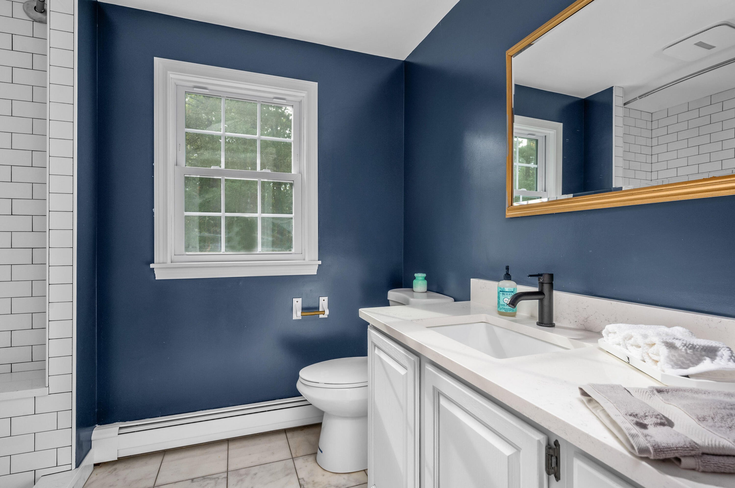 9 Tarragon Circle Cotuit, MA 02635 - Photo 11 of 28 a bathroom with a sink toilet and a mirror