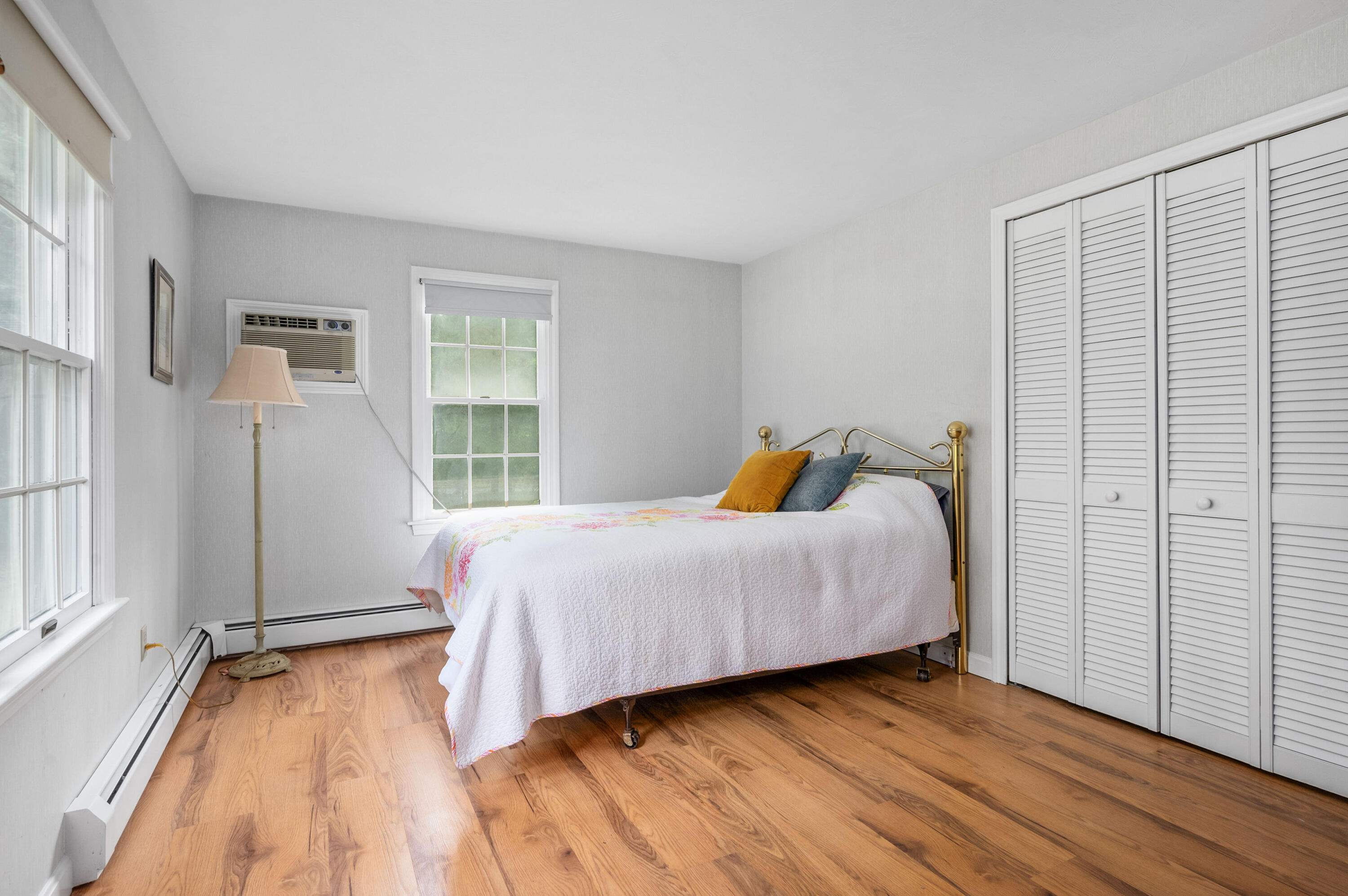 9 Tarragon Circle Cotuit, MA 02635 - Photo 12 of 28 a bedroom with a bed and wooden floor