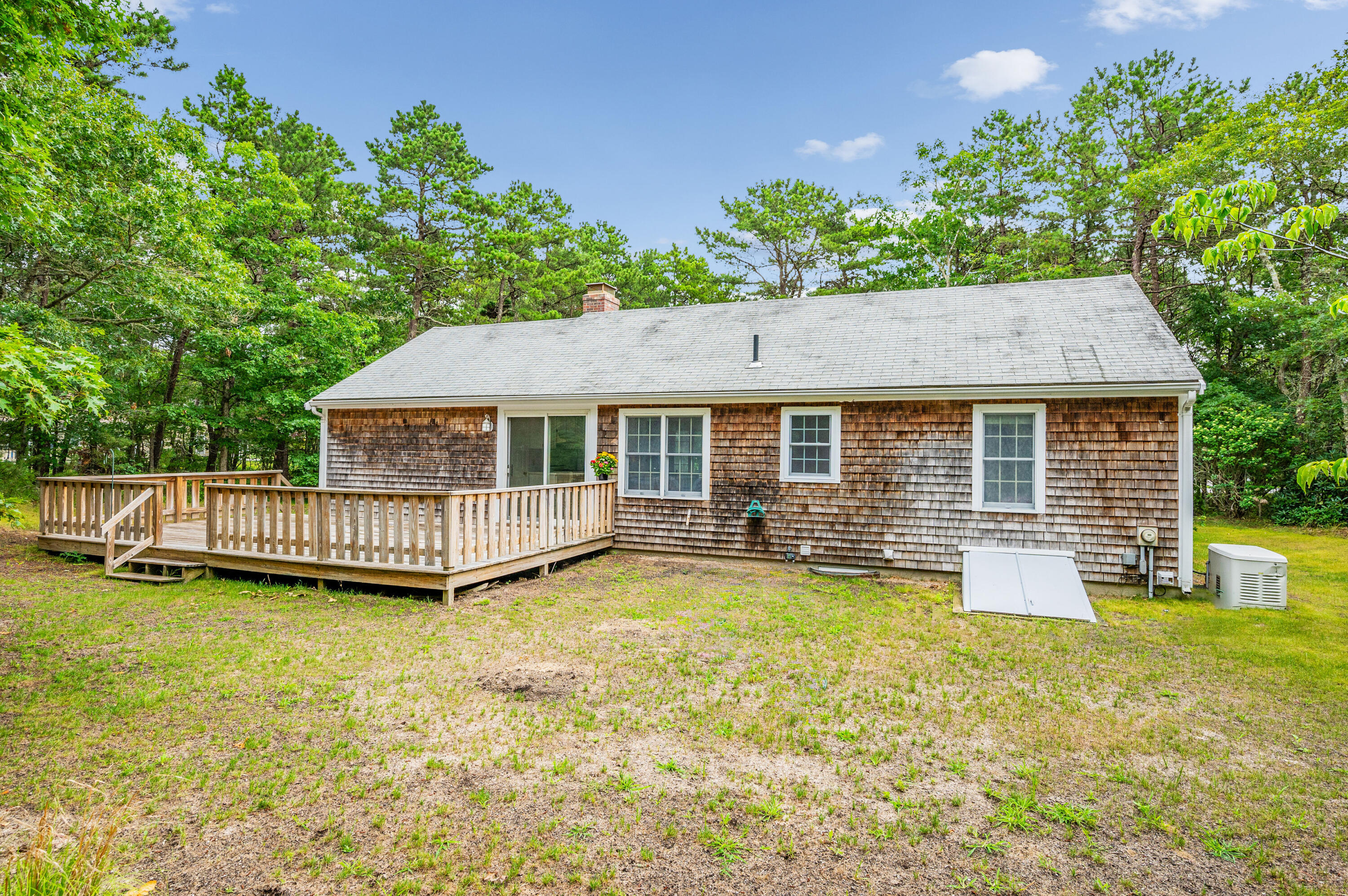 9 Tarragon Circle Cotuit, MA 02635 - Photo 21 of 28 a view of a house with swimming pool and sitting area