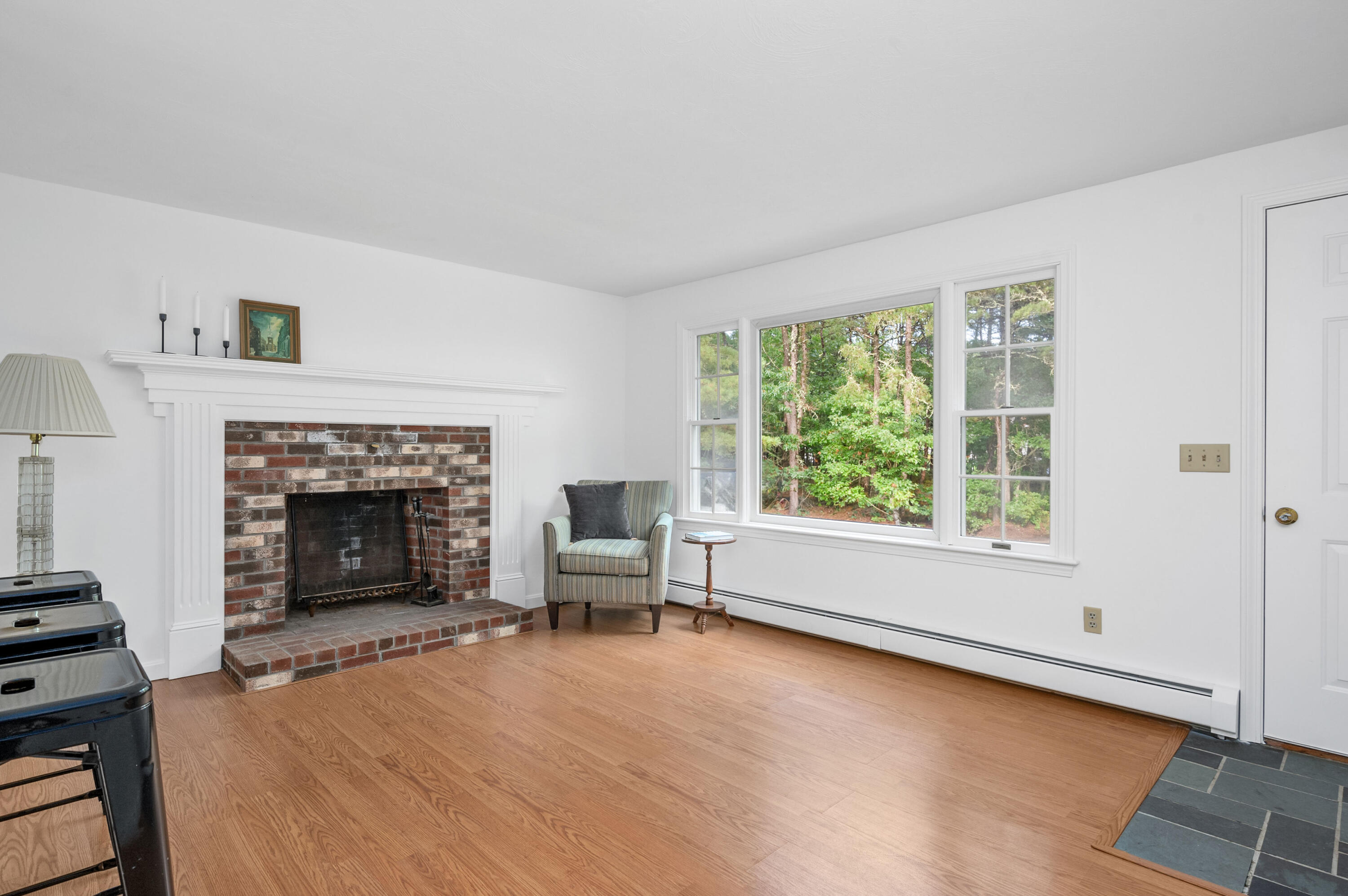 9 Tarragon Circle Cotuit, MA 02635 - Photo 5 of 28 a living room with furniture and a fireplace