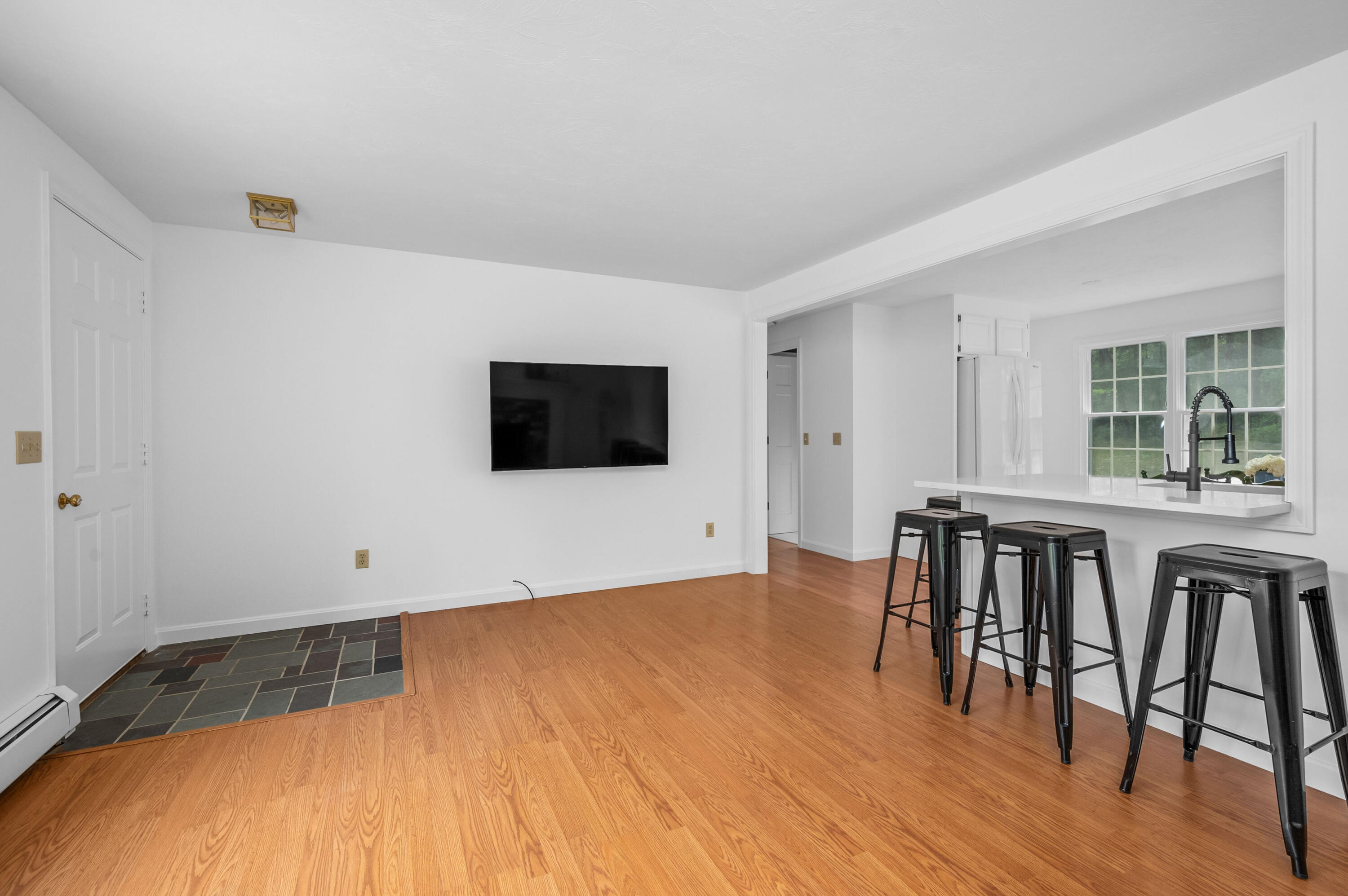 9 Tarragon Circle Cotuit, MA 02635 - Photo 6 of 28 a view of a livingroom with furniture and wooden floor