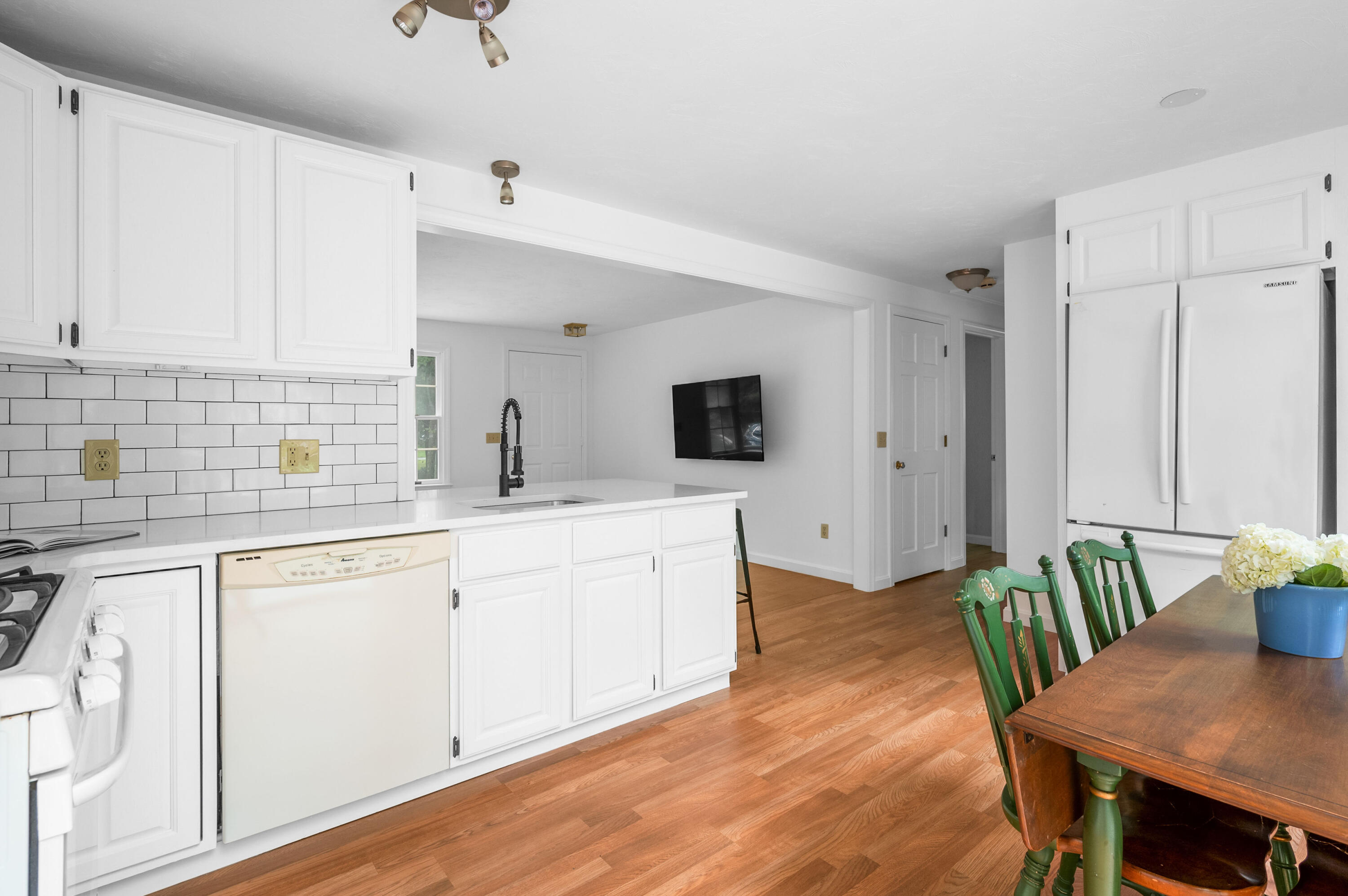 9 Tarragon Circle Cotuit, MA 02635 - Photo 10 of 28 a kitchen with white cabinets and sink