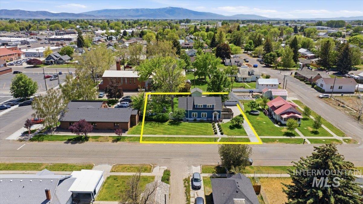 813 7th Street Rupert, ID 83350 - Photo 48 of 48 Blue two-story residence with a white-trimmed façade and dark roofing