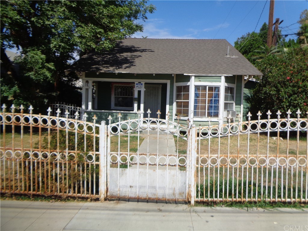 a front view of a house with glass windows and a table