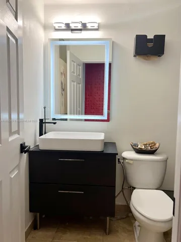 a bathroom with a toilet and a sink
