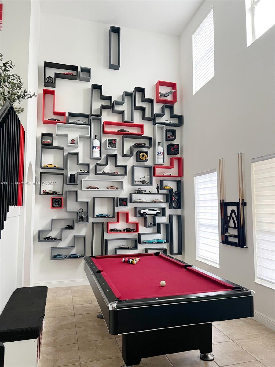 20124 Southwest 129th Place, Unit 20124 Miami, FL 33177 - Photo 13 of 31 a room with lots of books and chairs