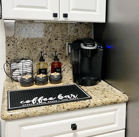 a bathroom with a sink vanity and mirror