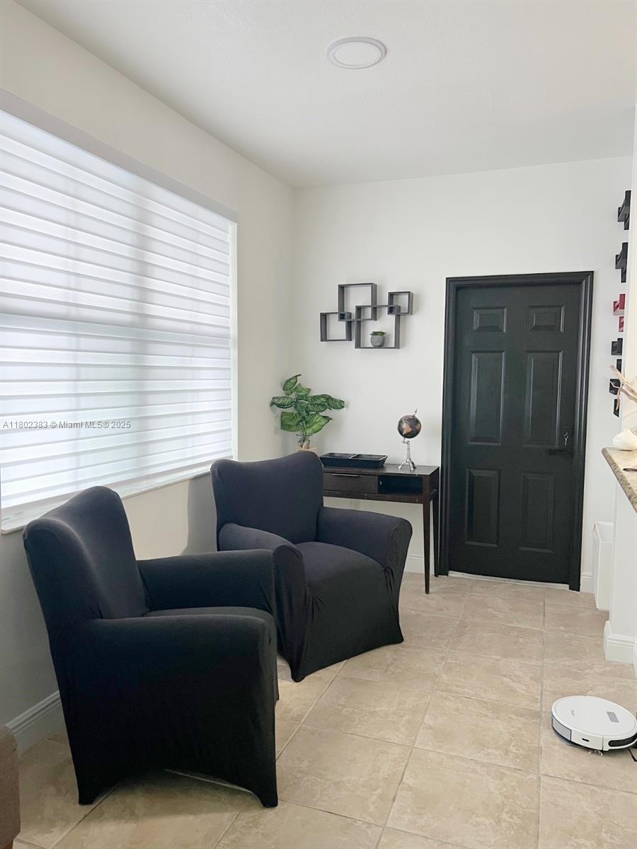20124 Southwest 129th Place, Unit 20124 Miami, FL 33177 - Photo 17 of 31 a living room with furniture