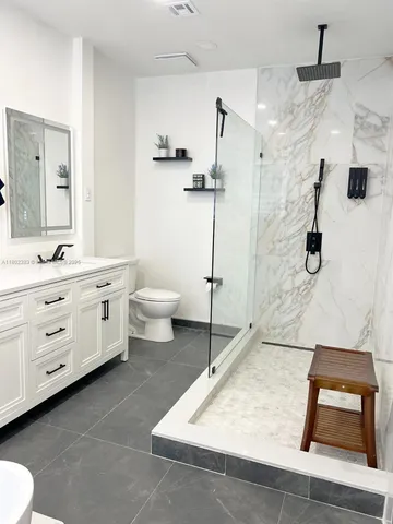 a living room with a couch and a fireplace