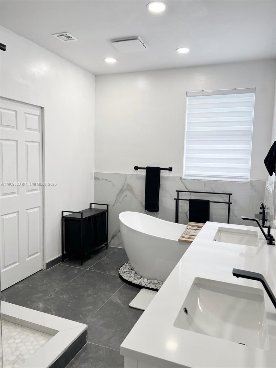 20124 Southwest 129th Place, Unit 20124 Miami, FL 33177 - Photo 19 of 31 a living room with a couch and a fireplace