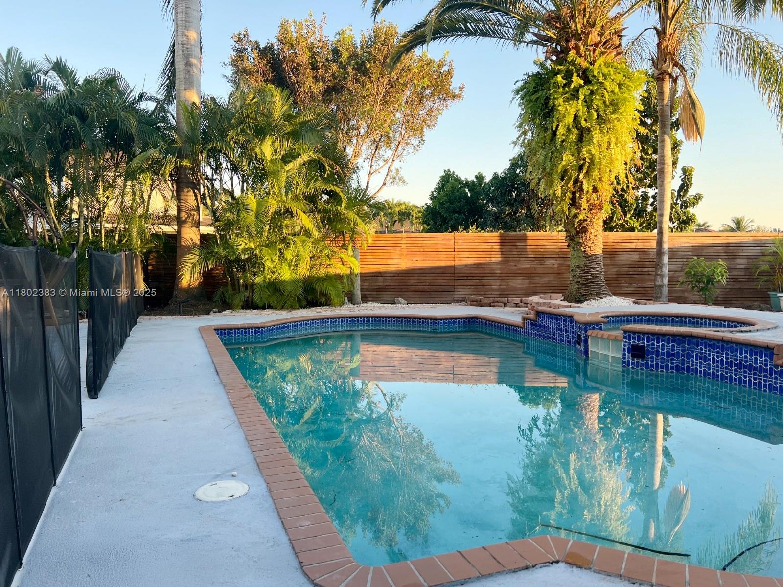 20124 Southwest 129th Place, Unit 20124 Miami, FL 33177 - Photo 2 of 31 a view of a lake with a house