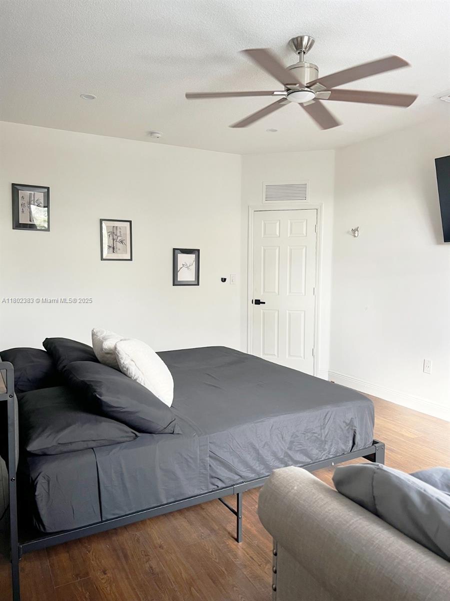 20124 Southwest 129th Place, Unit 20124 Miami, FL 33177 - Photo 23 of 31 a living room with furniture and a couch