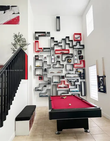 a room with furniture and a book shelf