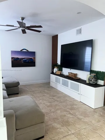 a kitchen with appliances a sink and cabinets
