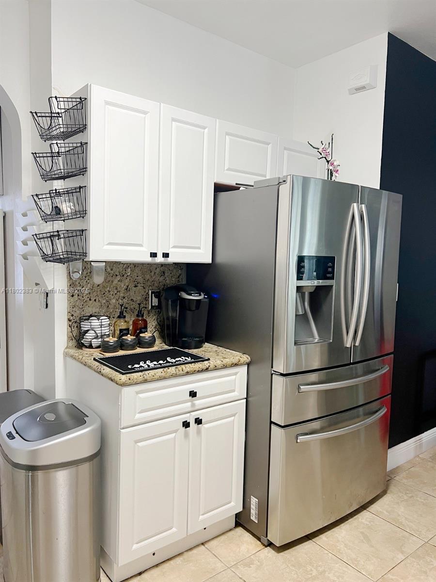 20124 Southwest 129th Place, Unit 20124 Miami, FL 33177 - Photo 9 of 31 a kitchen with appliances a sink and cabinets