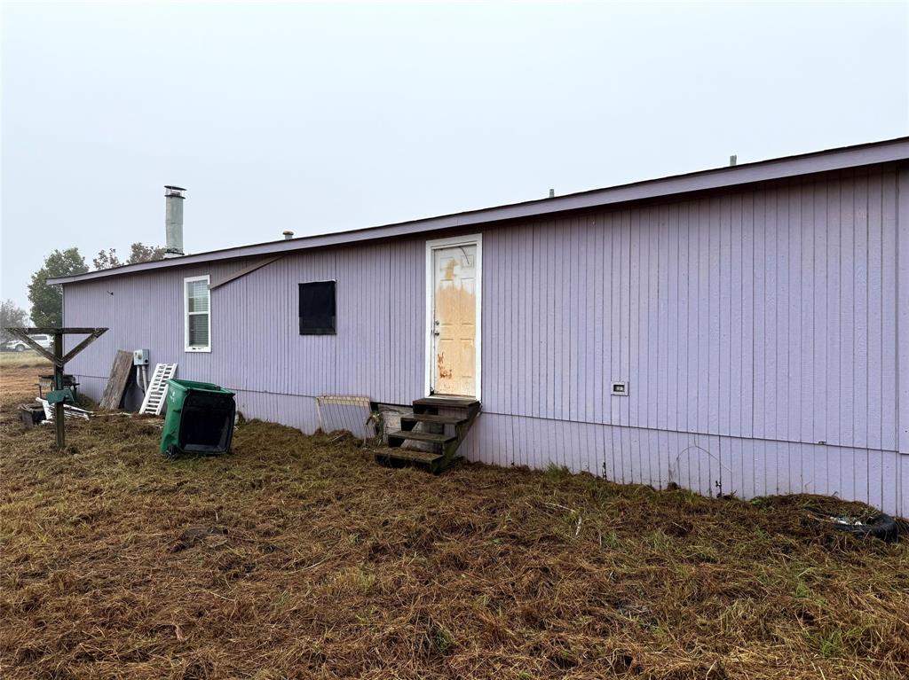 1047 John Wayne Road Kaufman, TX 75142 - Photo 3 of 17 Back of property featuring entry steps