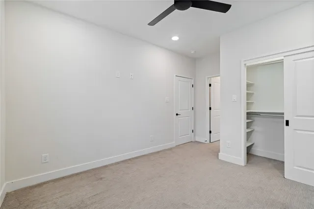 an empty room with ceiling fan