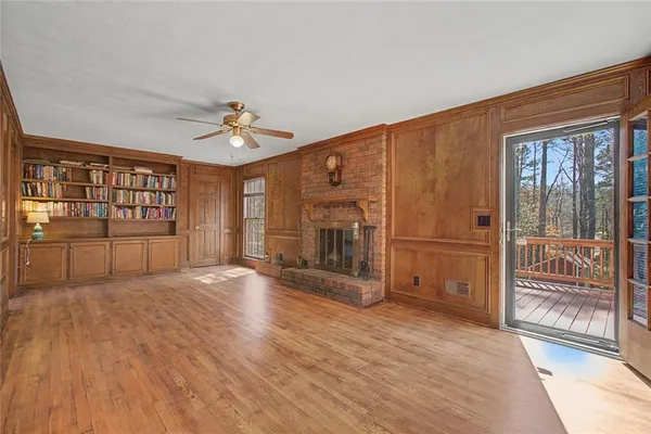 a spacious kitchen with stainless steel appliances granite countertop a sink and a refrigerator