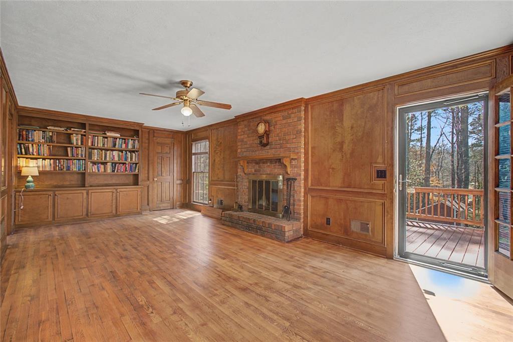 5877 Millstone Run Stone Mountain, GA 30087 - Photo 15 of 71 a view of an empty room with a fireplace and a window