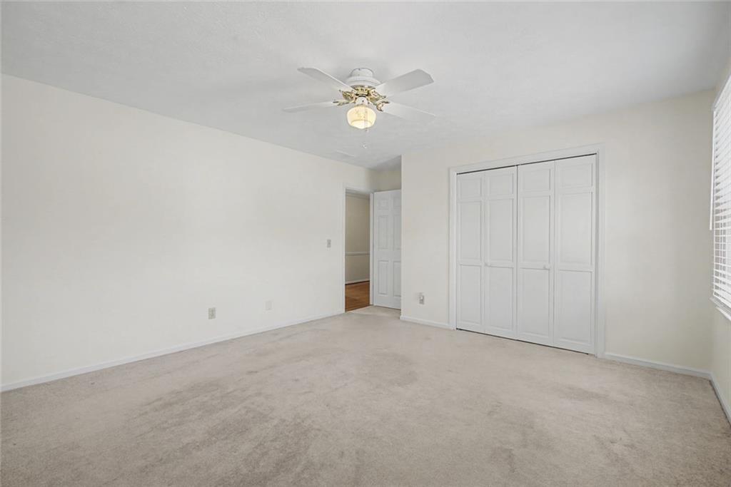 5877 Millstone Run Stone Mountain, GA 30087 - Photo 35 of 71 a view of an empty room with a chandelier fan