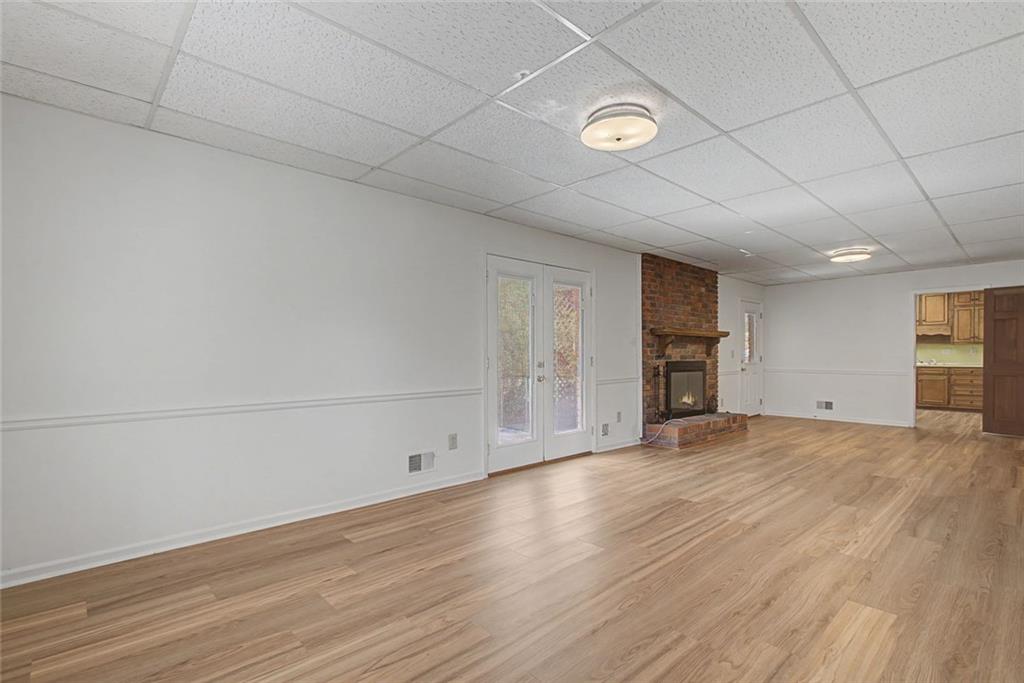 5877 Millstone Run Stone Mountain, GA 30087 - Photo 40 of 71 a view of empty room with wooden floor