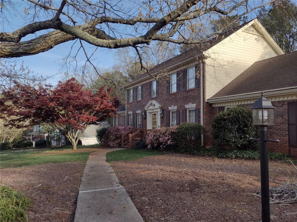 5877 Millstone Run Stone Mountain, GA 30087 - Photo 4 of 71 a view of a building with a yard