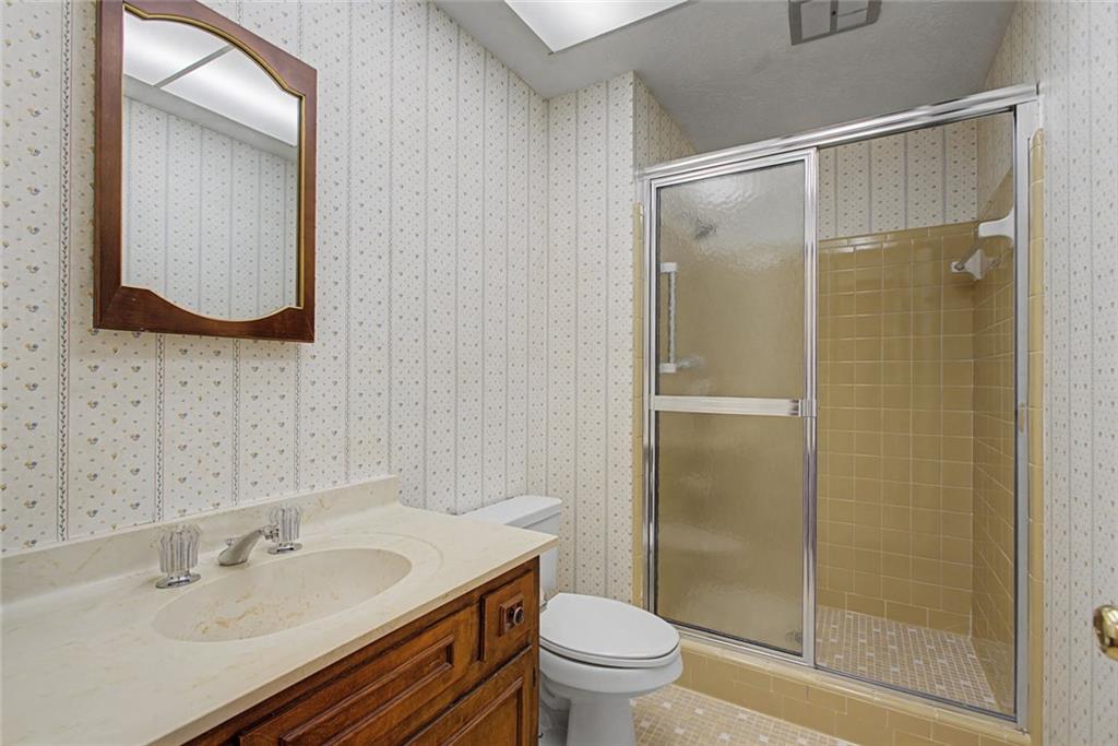 5877 Millstone Run Stone Mountain, GA 30087 - Photo 45 of 71 a bathroom with a sink and a mirror