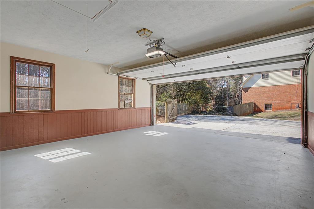 5877 Millstone Run Stone Mountain, GA 30087 - Photo 54 of 71 a view of a livingroom with wooden floor and windows