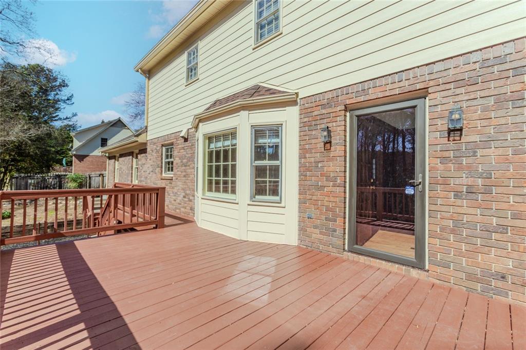 5877 Millstone Run Stone Mountain, GA 30087 - Photo 58 of 71 a view of a house on wooden deck