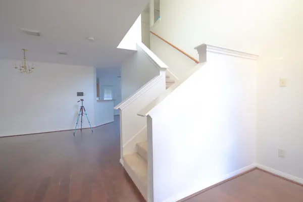 a view of a hallway with staircase