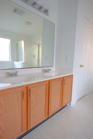 a view of a kitchen with granite countertop cabinets and a wooden floor