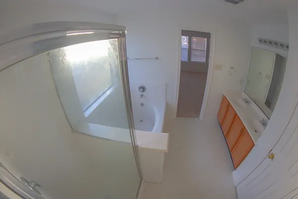 a view of a livingroom with wooden floor and stairs