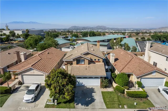an aerial view of a house with a ocean view