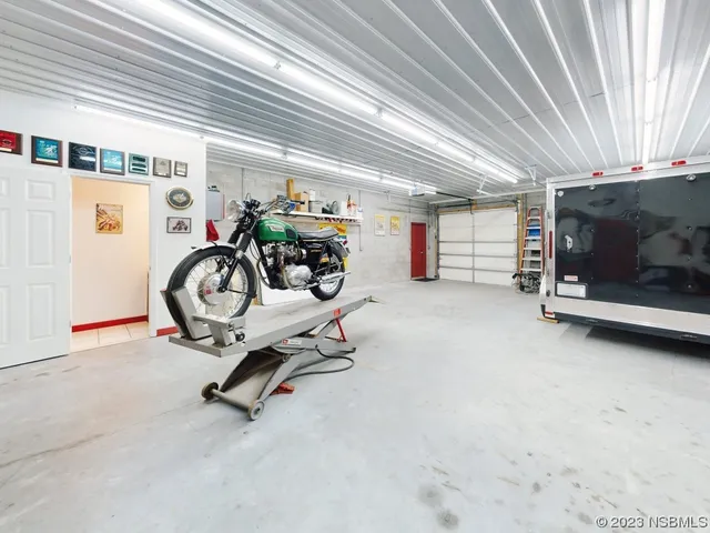 a front view of house with yard outdoor seating and barbeque oven