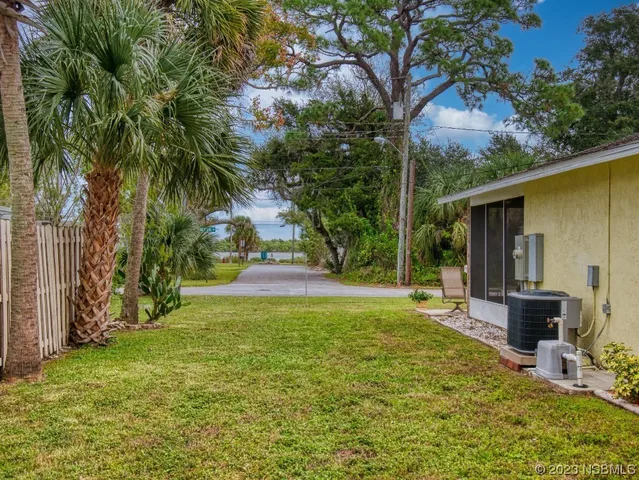 a view of a street with a building in the back