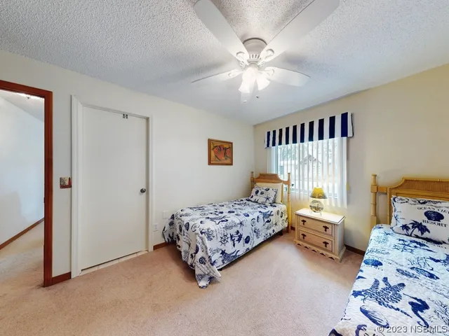 a bedroom with bed and window