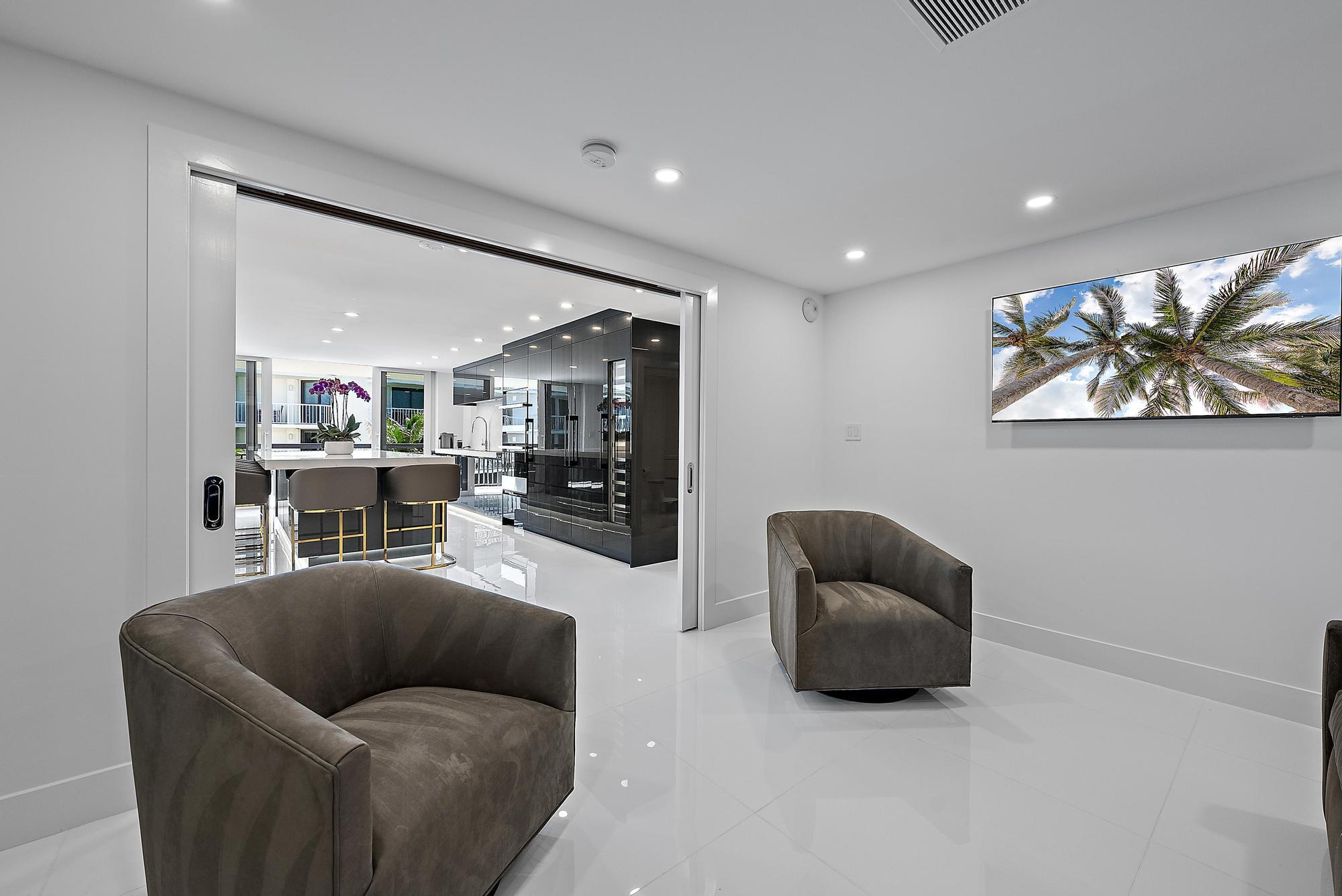 3140 South Ocean Boulevard, Unit 502S Palm Beach, FL 33480 - Photo 11 of 30 a living room with furniture and a large mirror