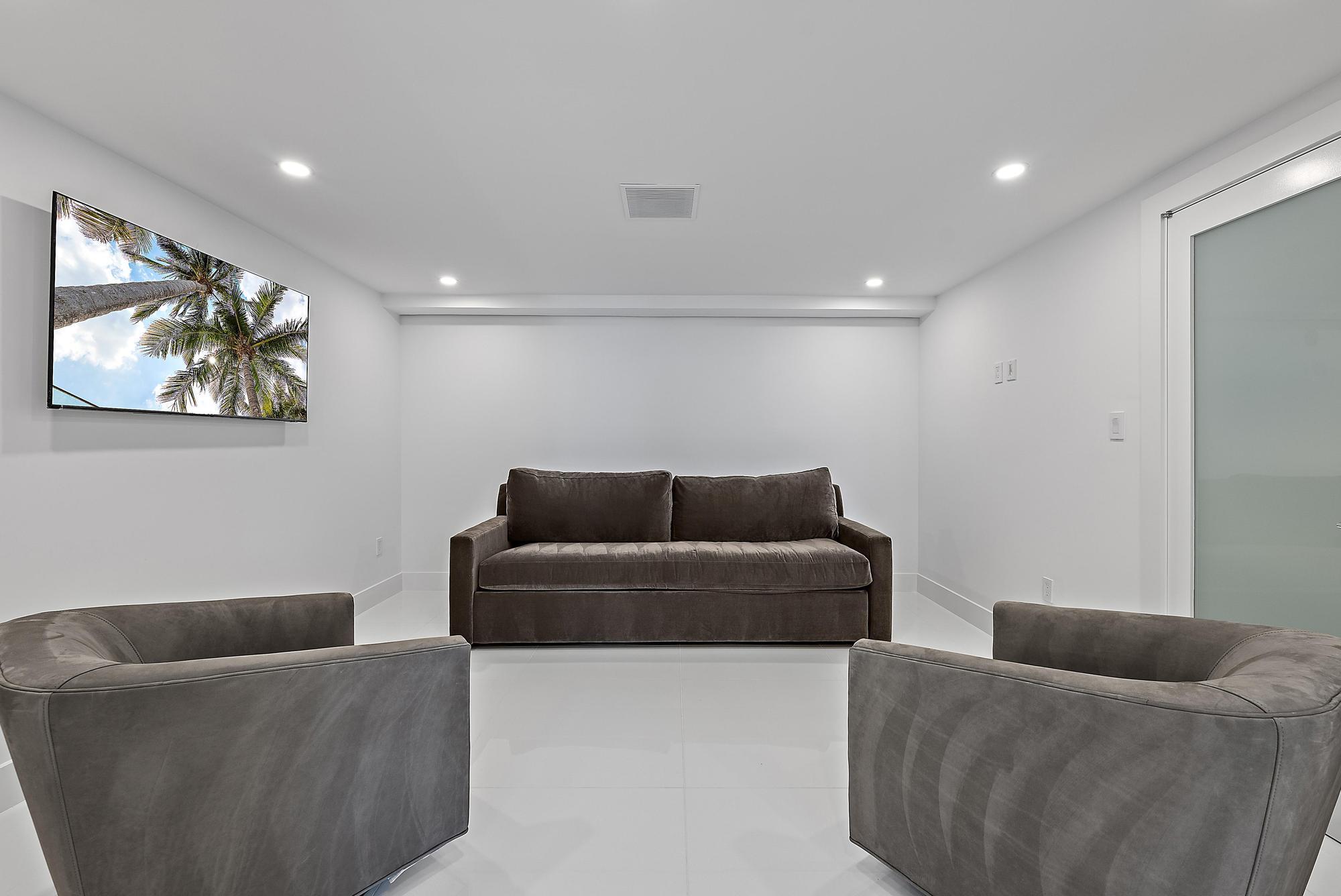 3140 South Ocean Boulevard, Unit 502S Palm Beach, FL 33480 - Photo 12 of 30 a living room with furniture and a couch