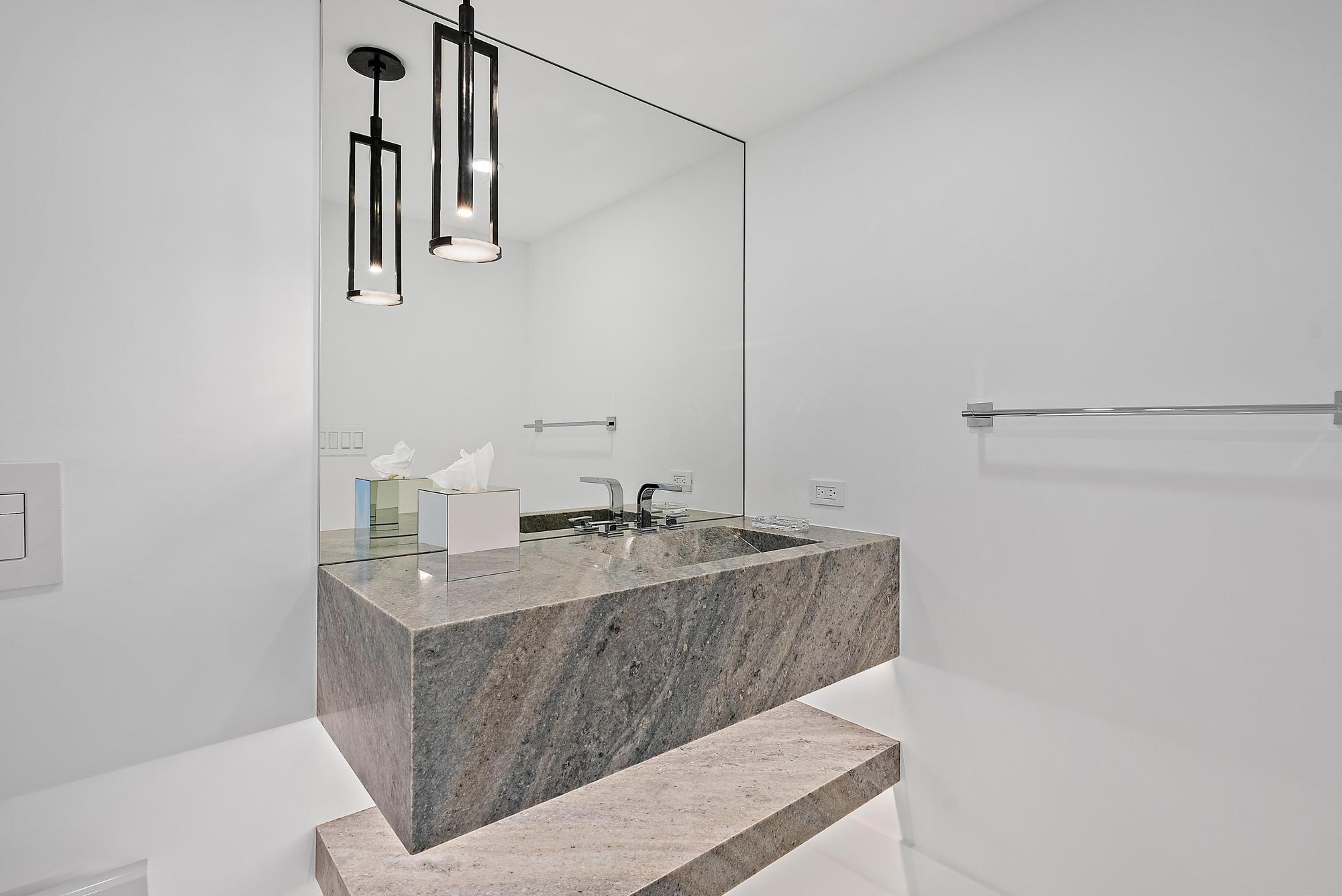 3140 South Ocean Boulevard, Unit 502S Palm Beach, FL 33480 - Photo 20 of 30 a bathroom with a granite countertop sink a mirror and vanity