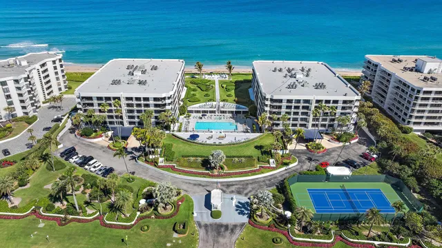 a view of a house with a backyard and a yard