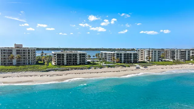 a view of a house with a backyard and a garden