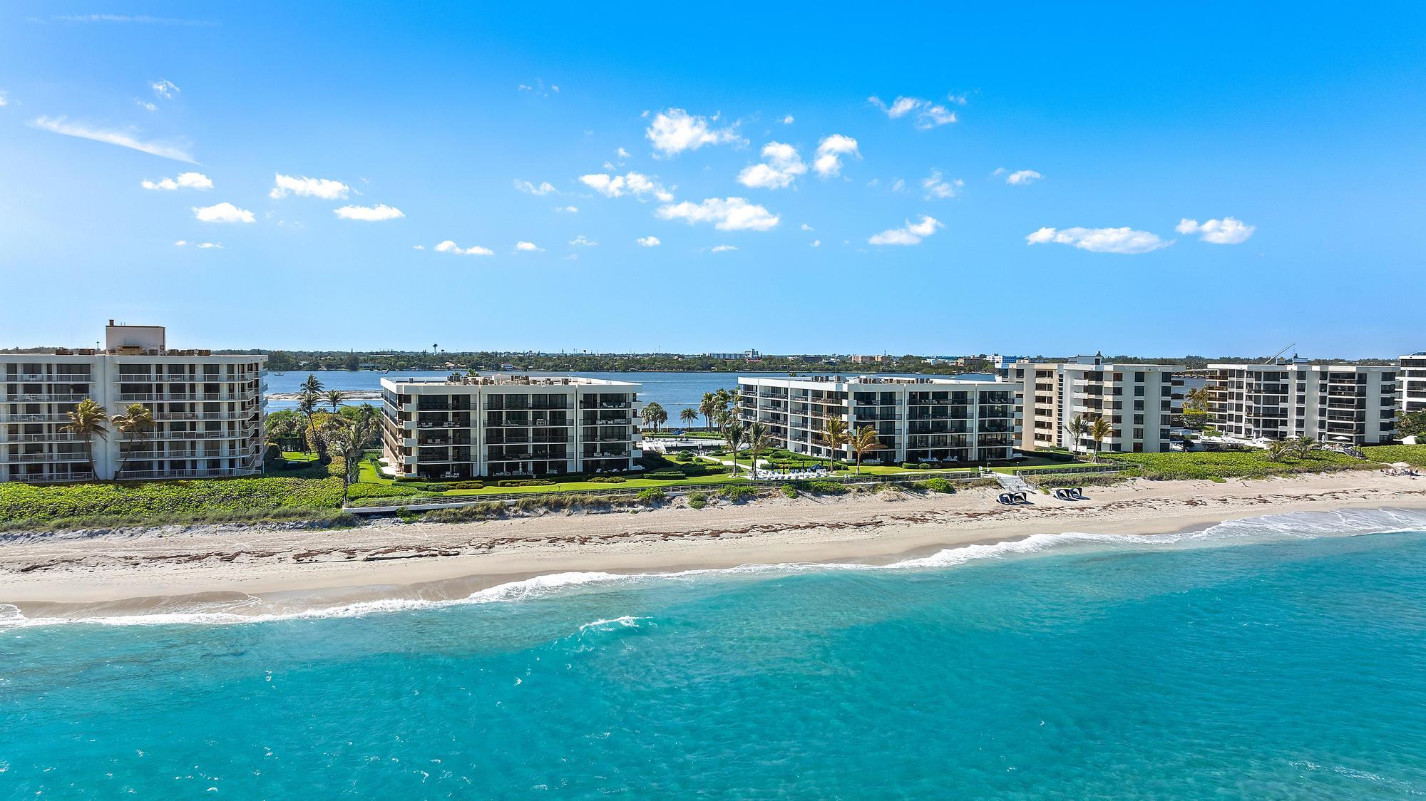 3140 South Ocean Boulevard, Unit 502S Palm Beach, FL 33480 - Photo 25 of 30 a view of a house with a backyard and a yard